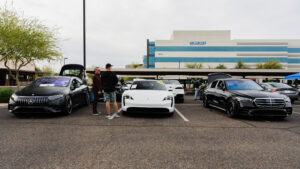 BESPOKEV Cars and Coffee Mercedes-Benz EQS AMG, Mercedes Hybrid and Porsche Taycan display electric vehicles.