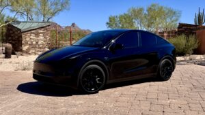 2025 Tesla Model Y Left Side 2025 Tesla Model Y rental car in Scottsdale and Phoenix, AZ with free Full Self-Driving (Supervised)