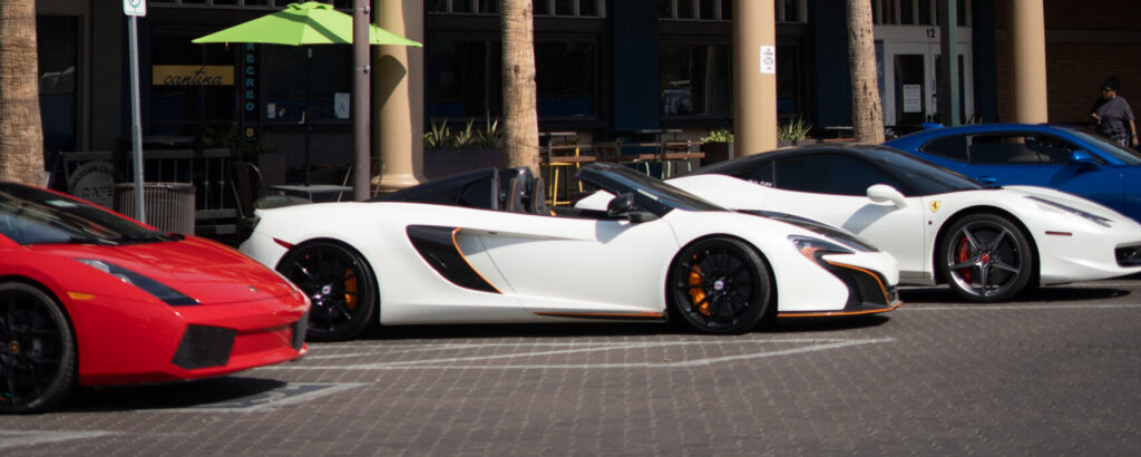 Exotic cars lined up on the street at Cars and Coffee Chandler in Historic Downtown Chandler, Arizona